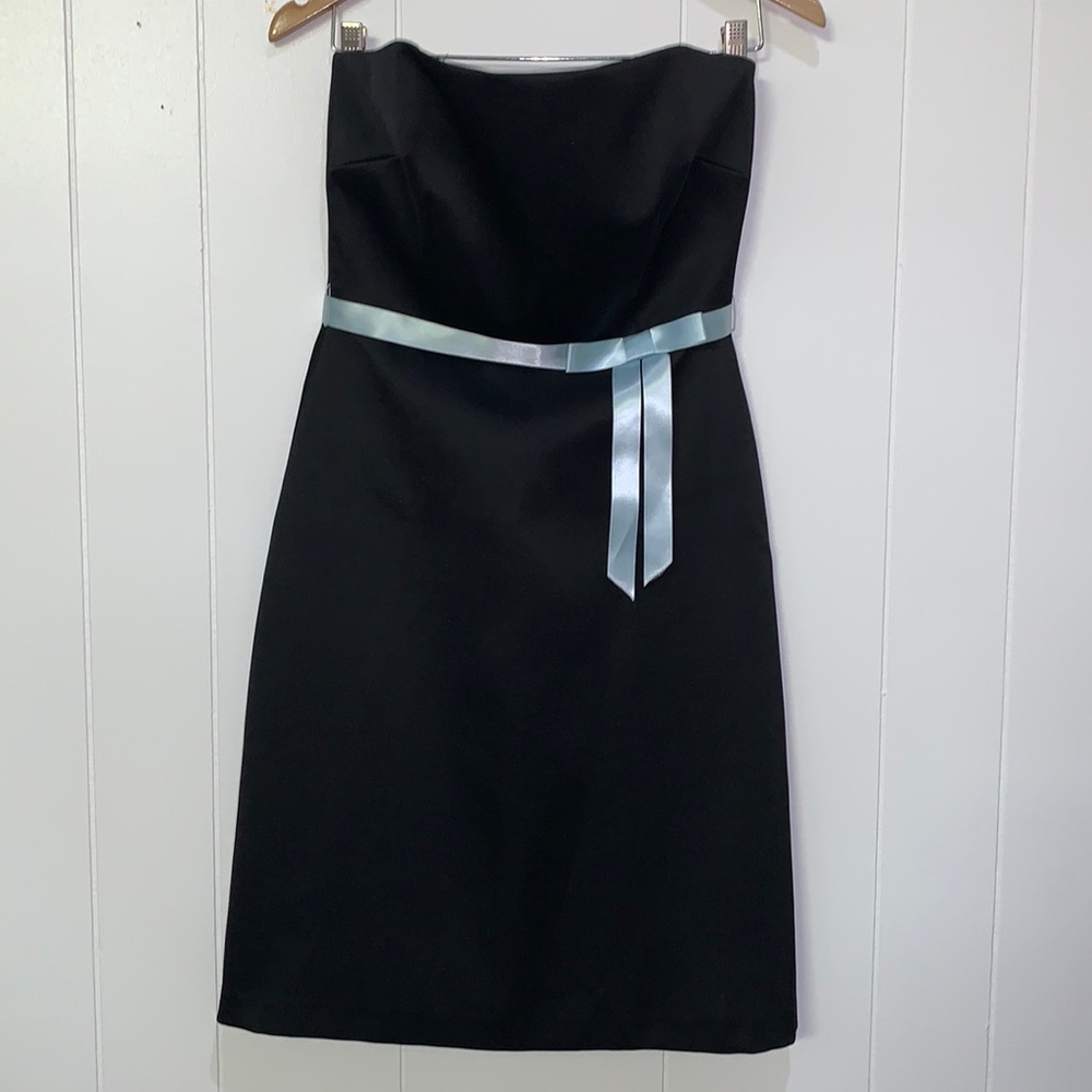 Strapless satin black dress with bow.